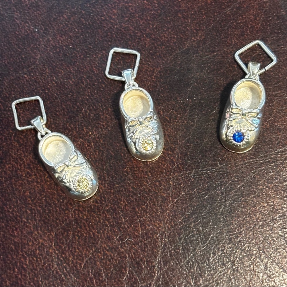 Sterling silver baby shoe pendant with clear and blue rhinestones